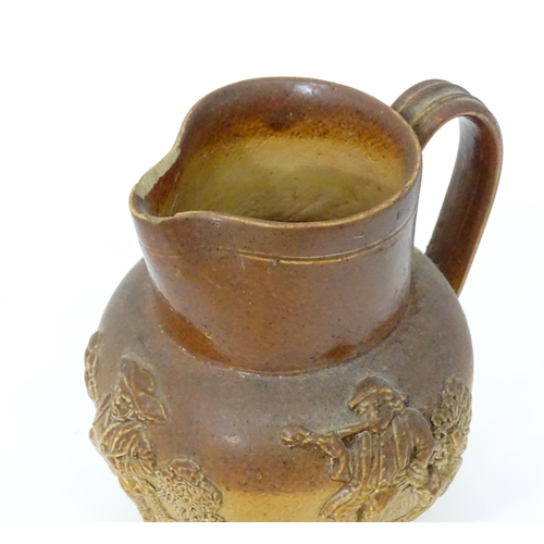 121 - A Doulton Lambeth two tone jug with relief decoration. Together with a two tone stoneware jug with C... 