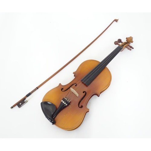 147 - A cased student's violin, labelled 'Lark' to the interior. Approx 22