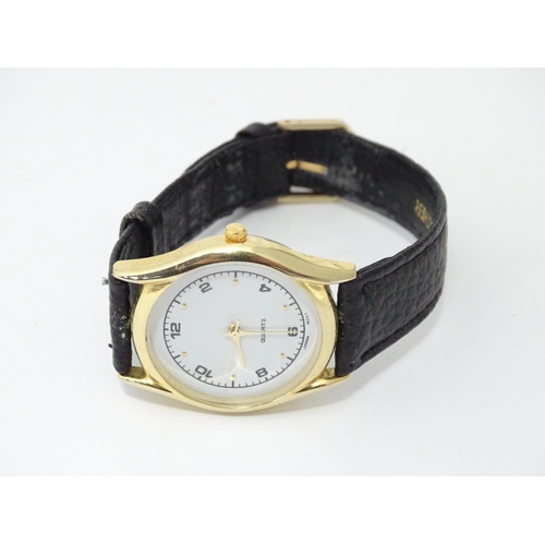 471 - A gentleman's wristwatch with Japanese movement and leather strap. The case approx 1 1/4