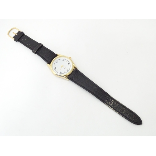 471 - A gentleman's wristwatch with Japanese movement and leather strap. The case approx 1 1/4