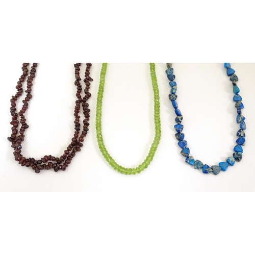 492 - Three various bead necklaces to include one of turquoise coloured beads, another of garnet coloured ... 