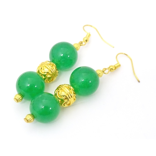 502 - Assorted jade jewellery to include bead necklace and earrings and two bangles.