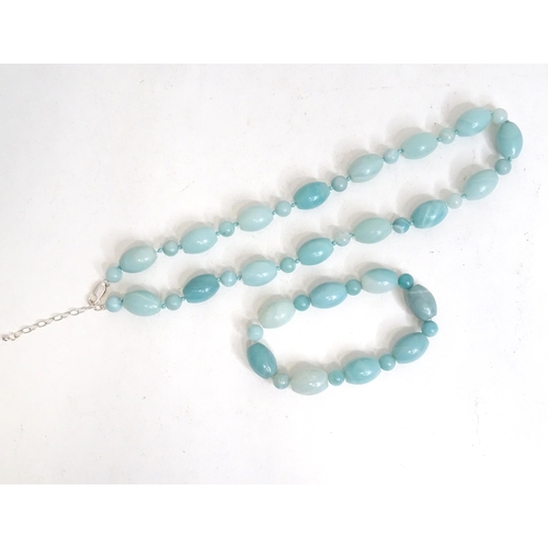 507 - A jade coloured bead necklace together with a matching bracelet. The necklace approx. 18