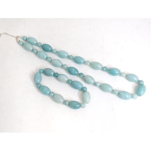 507 - A jade coloured bead necklace together with a matching bracelet. The necklace approx. 18