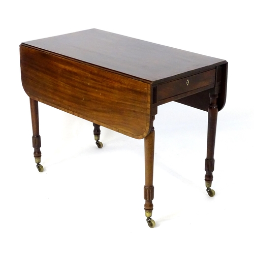 542 - An early / mid 19thC mahogany Pembroke table with a rectangular top flanked by drop flaps with eboni... 