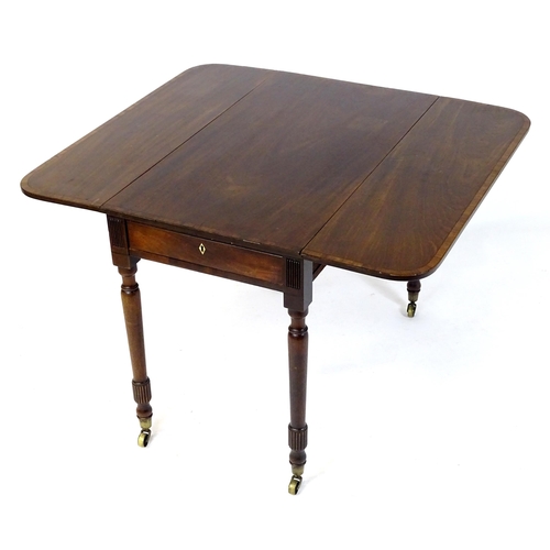 542 - An early / mid 19thC mahogany Pembroke table with a rectangular top flanked by drop flaps with eboni... 