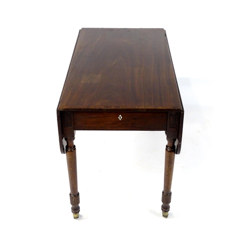 542 - An early / mid 19thC mahogany Pembroke table with a rectangular top flanked by drop flaps with eboni... 