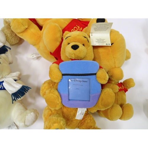 543 - A quantity of assorted Winnie the Pooh soft / cuddly toys to include examples from the Disney Store,... 