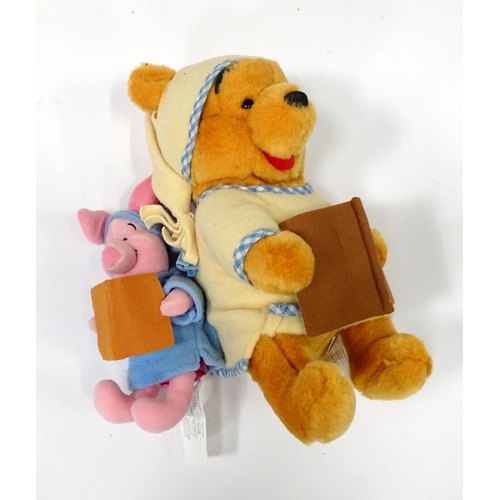 543 - A quantity of assorted Winnie the Pooh soft / cuddly toys to include examples from the Disney Store,... 