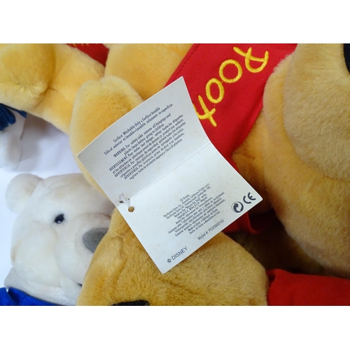 543 - A quantity of assorted Winnie the Pooh soft / cuddly toys to include examples from the Disney Store,... 