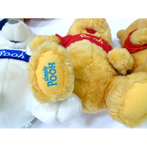 543 - A quantity of assorted Winnie the Pooh soft / cuddly toys to include examples from the Disney Store,... 