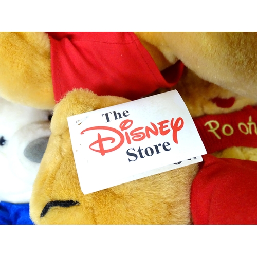 543 - A quantity of assorted Winnie the Pooh soft / cuddly toys to include examples from the Disney Store,... 