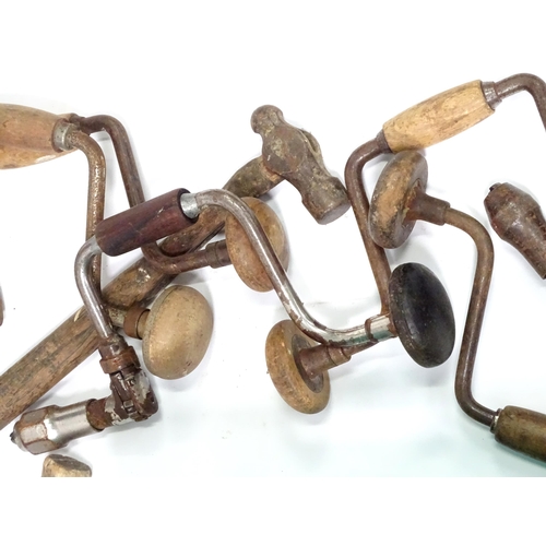 672 - A quantity of 20thC hand tools, including drills, hammer, saw, gardening implements, scales etc.