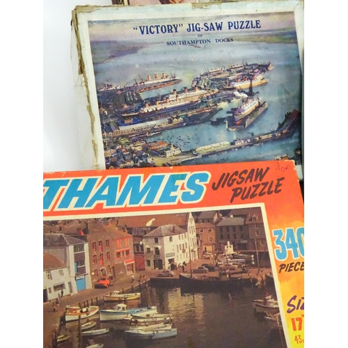 101 - Toys: A quantity of early to mid 20thC jigsaw puzzles, examples including period costumes, railways,... 