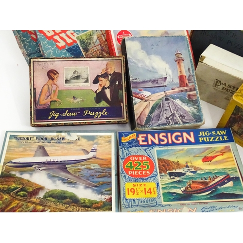 101 - Toys: A quantity of early to mid 20thC jigsaw puzzles, examples including period costumes, railways,... 