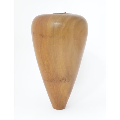 115 - A wooden vase. Approx. 16