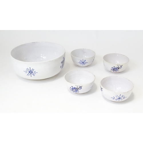 129 - A Gale serving bowl with hand painted blue shield decoration and four soup bowls with similar detail... 