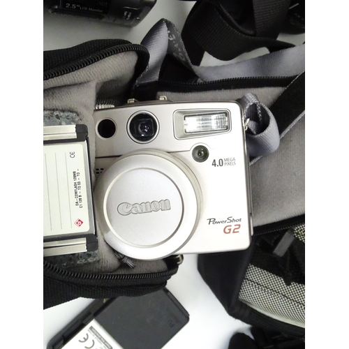 149 - A quantity of assorted film and digital cameras and accessories to include Olympus AF-1, Polaroid La... 