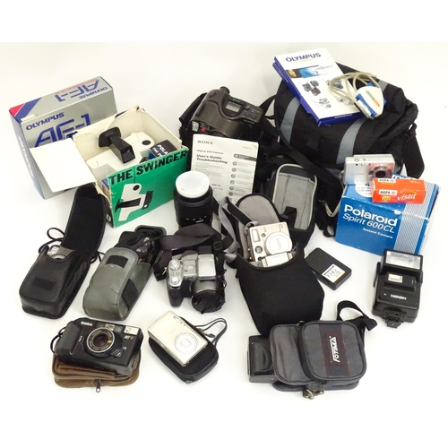 149 - A quantity of assorted film and digital cameras and accessories to include Olympus AF-1, Polaroid La... 