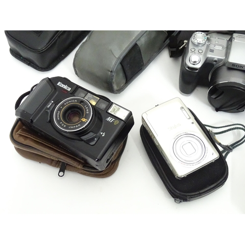 149 - A quantity of assorted film and digital cameras and accessories to include Olympus AF-1, Polaroid La... 