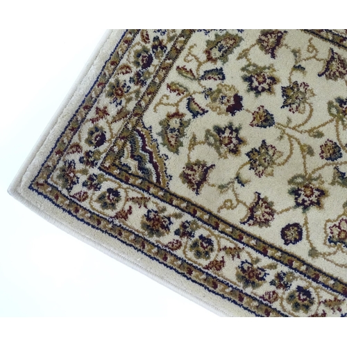 160 - A beige ground rug. Approx. 24