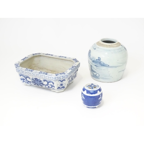 176 - Three Oriental items to include a hand painted jar with brushwork detail, a blue and white planter, ... 