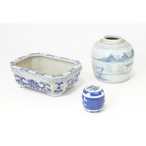 176 - Three Oriental items to include a hand painted jar with brushwork detail, a blue and white planter, ... 