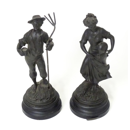 201 - Two 20thC French cast harvest figures, the female figure holding a flask, standing on a naturalistic... 