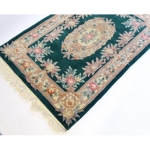 206 - Four modern rugs with tassels to the ends. The largest 79