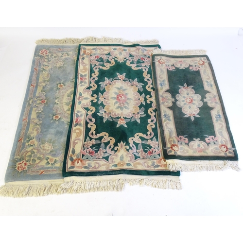 206 - Four modern rugs with tassels to the ends. The largest 79