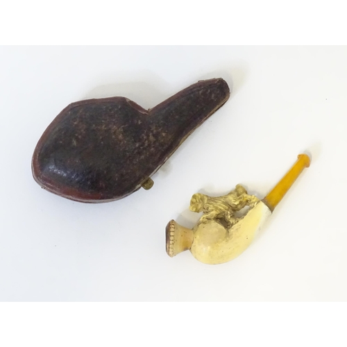 454 - A 19thc ladies' cased smoking pipe, the carved meerschaum bowl with spaniel dog decoration and amber... 