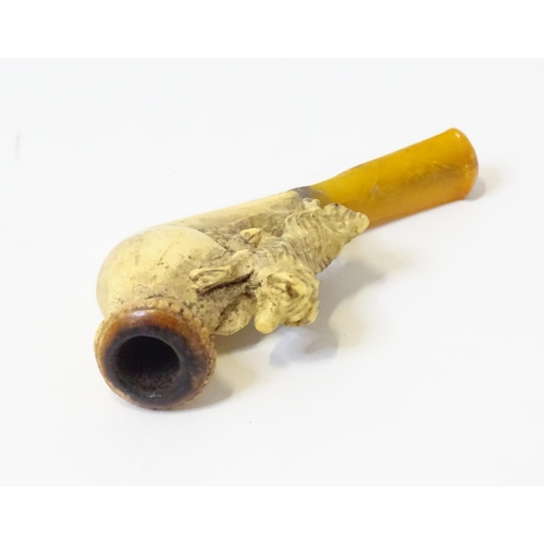 454 - A 19thc ladies' cased smoking pipe, the carved meerschaum bowl with spaniel dog decoration and amber... 