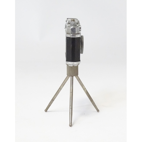 455 - A 20thC 'KKW Camera Lighter' novelty table top cigarette lighter modelled as a vintage camera on tri... 