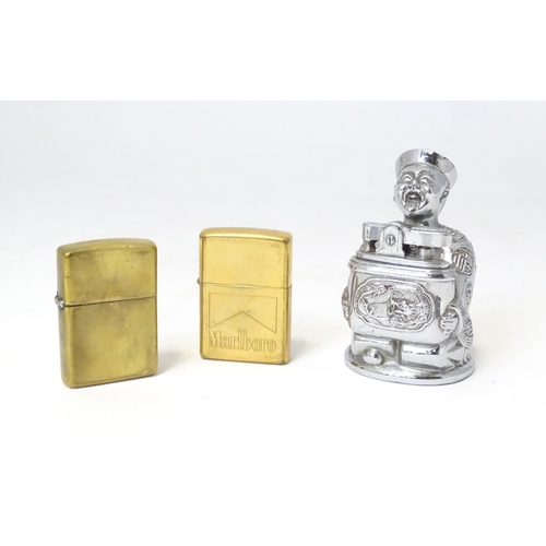 457 - A 20thC novelty table top lighter formed as a Chinese character, together with two c1990s Zippo pock... 