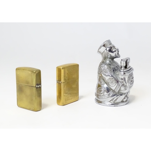 457 - A 20thC novelty table top lighter formed as a Chinese character, together with two c1990s Zippo pock... 