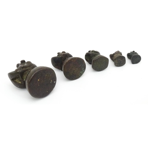 461 - Five Asian graduated bronze opium weights of stylised bird form. Together with a cast model of a chi... 