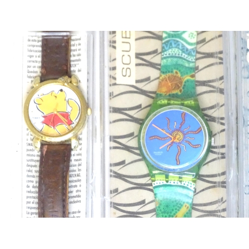 482 - Wristwatches : A quantity of assorted Swatch watches, together with an example by Minitz, etc.