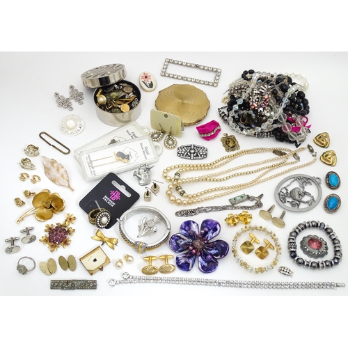 484 - A quantity of assorted costume jewellery to include brooches, beads, cufflinks, etc. Together with a... 