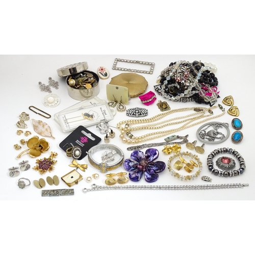 484 - A quantity of assorted costume jewellery to include brooches, beads, cufflinks, etc. Together with a... 