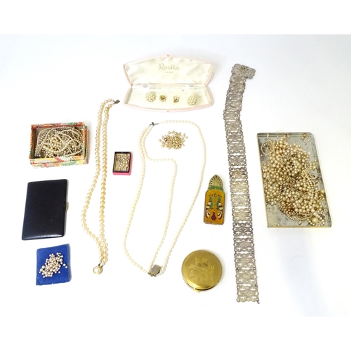 487 - A quantity of various pearls necklaces, a silver plate belt, assorted compacts, etc.