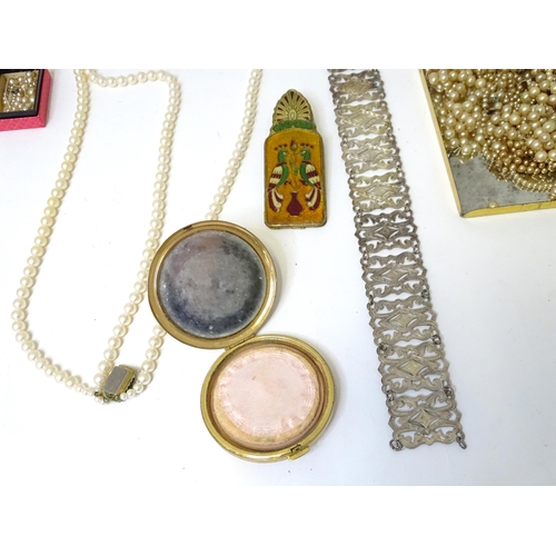 487 - A quantity of various pearls necklaces, a silver plate belt, assorted compacts, etc.