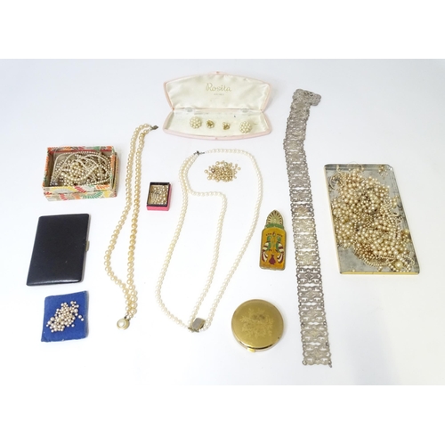 487 - A quantity of various pearls necklaces, a silver plate belt, assorted compacts, etc.