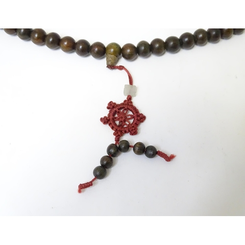 505 - An Oriental wooden bead necklace. Approx. 22