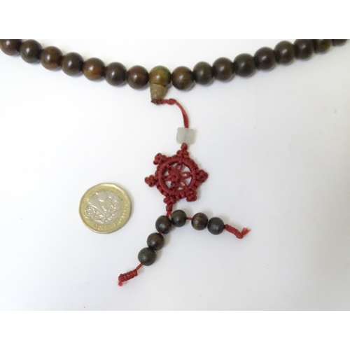 505 - An Oriental wooden bead necklace. Approx. 22