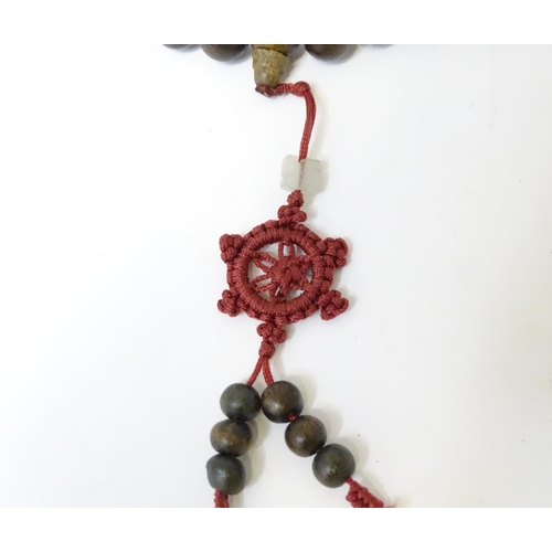 505 - An Oriental wooden bead necklace. Approx. 22