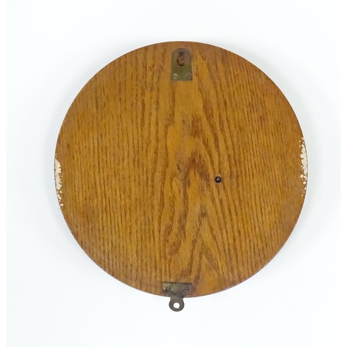 563 - A late 20thC display ships wheel, together with an oak cased aneroid barometer. The largest approx 2... 