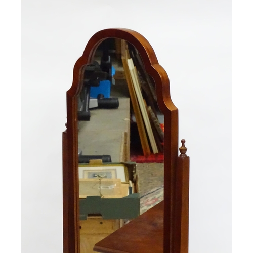 566 - A collection of furniture to include, cheval mirror, Canterbury and a serpentine shaped bedside cabi... 