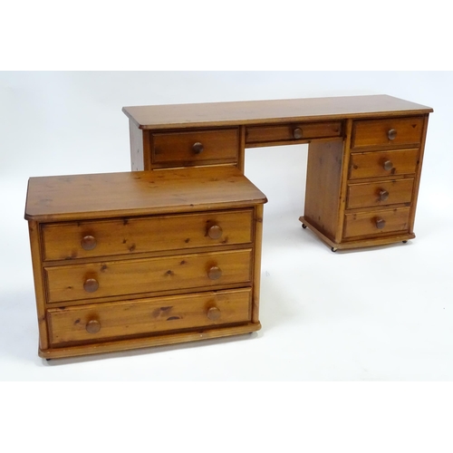 673 - A pine double pedestal desk with two banks of four short drawers and a draw to the centre. Together ... 