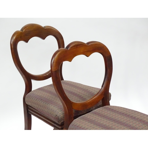 824 - A pair of Victorian mahogany dining chairs with balloon backs, together with a pair of Edwardian sid... 