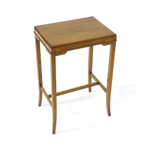 843 - An early / mid 20thC oak side table with a rectangular top above applied mouldings to the apron and ... 